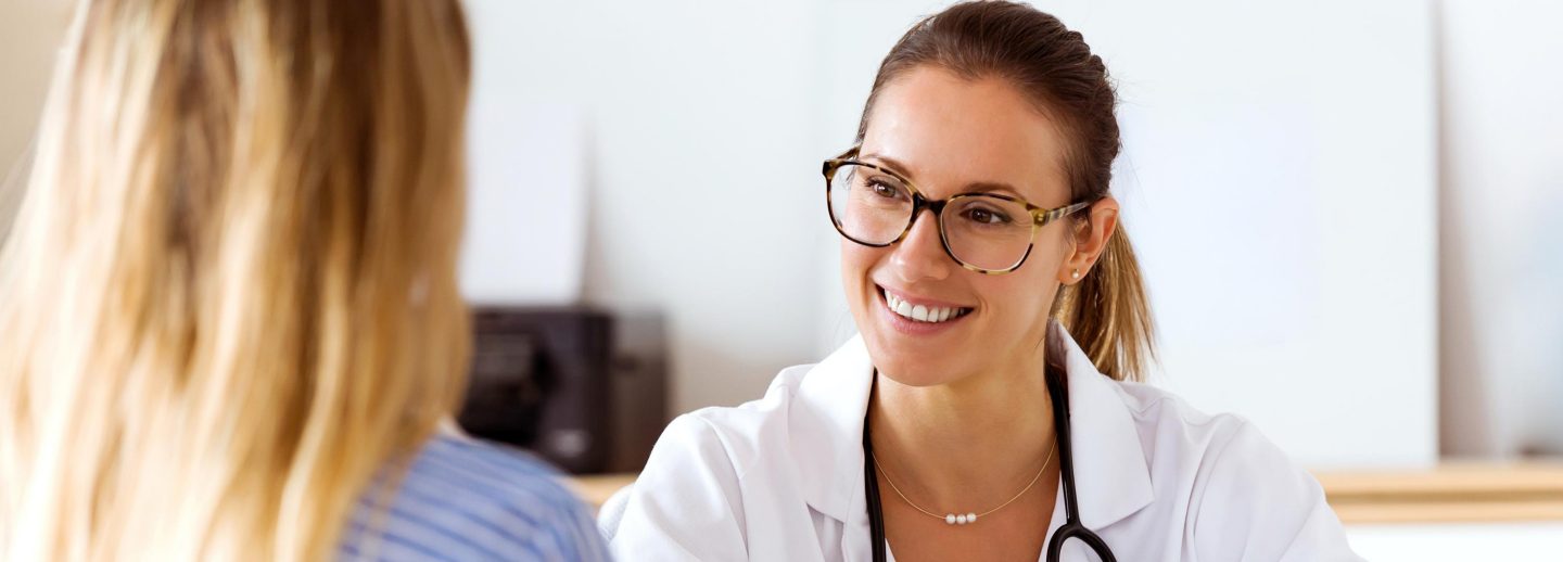 Portrait of female doctor explaining diagnosis to her patient.