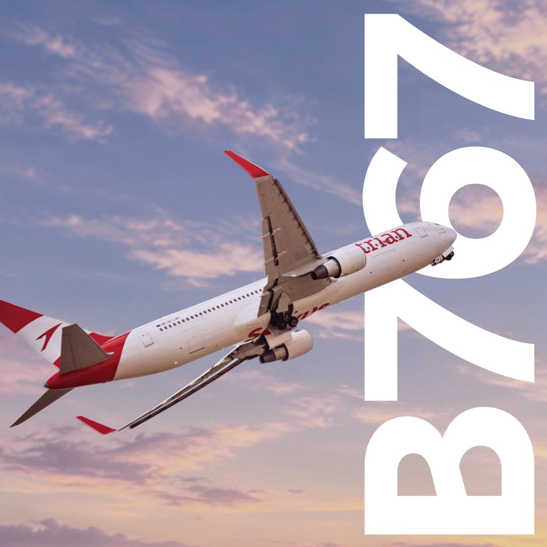 Austrian Airlines Boeing 767 flying against a pink evening sky, with a large white 767 graphic