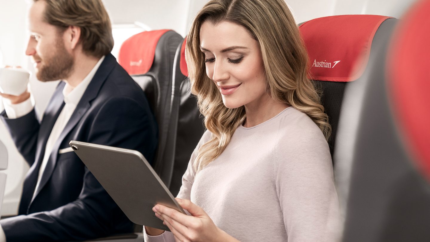 A woman uses her tablet in an Austrian plane