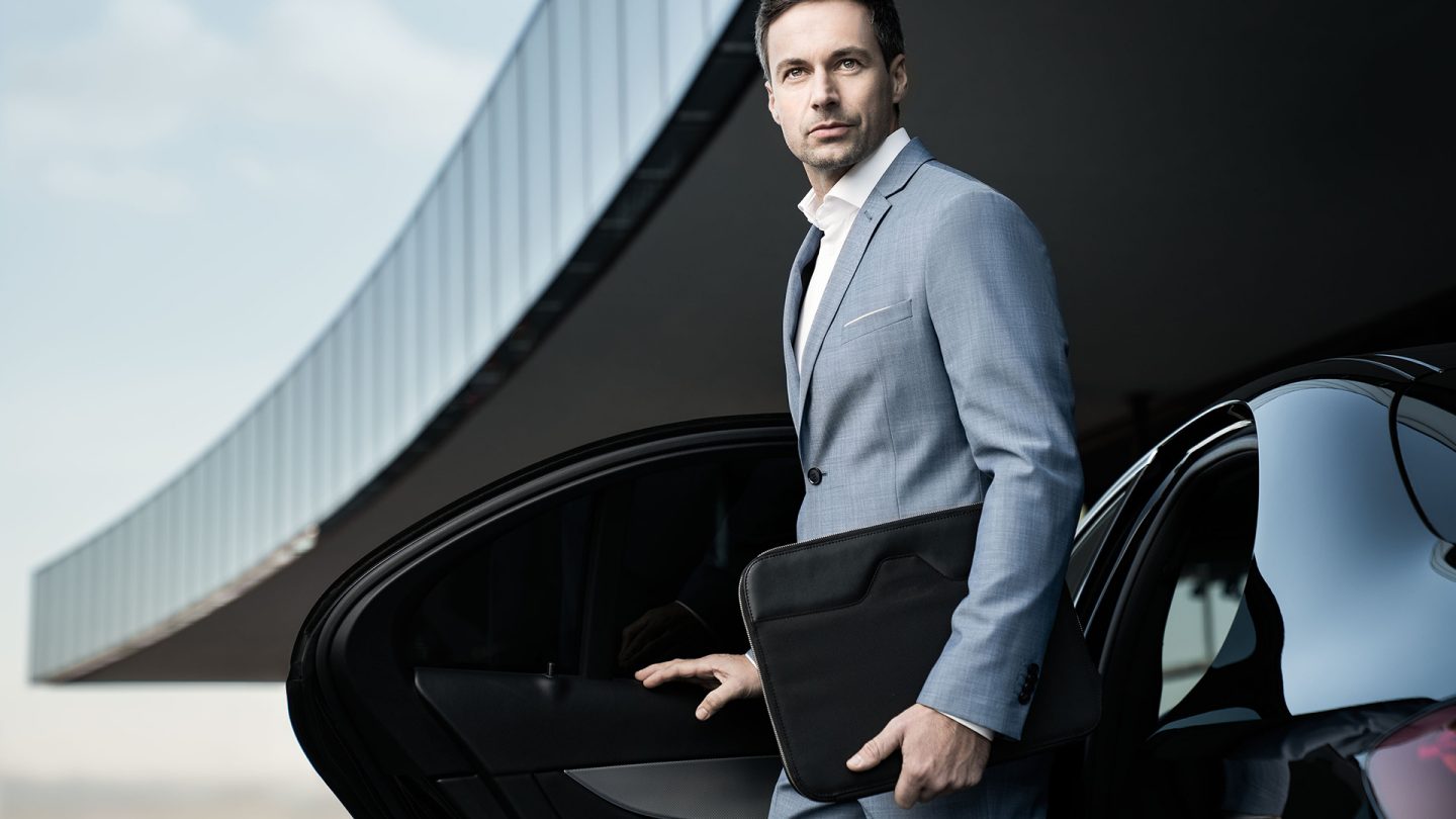 A businessman getting out of a car