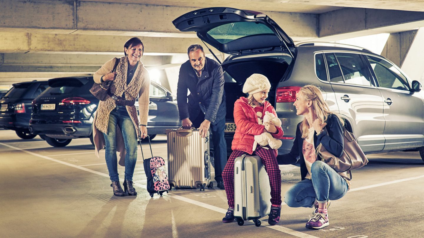 Parents pick up their daughter with grandchild from the airport