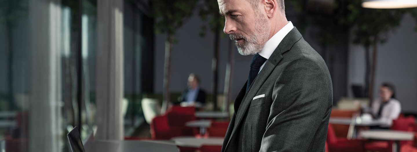 Businessman using laptop in Austrian lounge