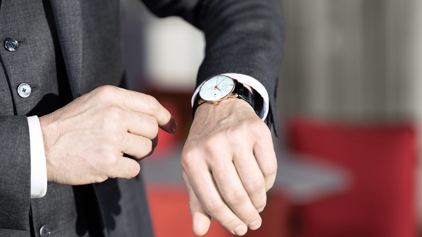 A man looks at his watch