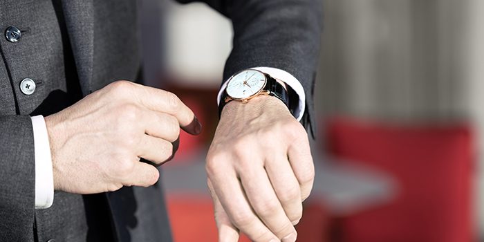 A man looks at his watch